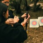 Fartlek Training - A man and woman are shooting arrows at a target