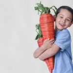 Trail Nutrition - Young Boy with Carrot