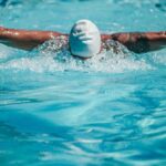 Swim Strokes - A Swimmer Doing the Butterfly Stroke