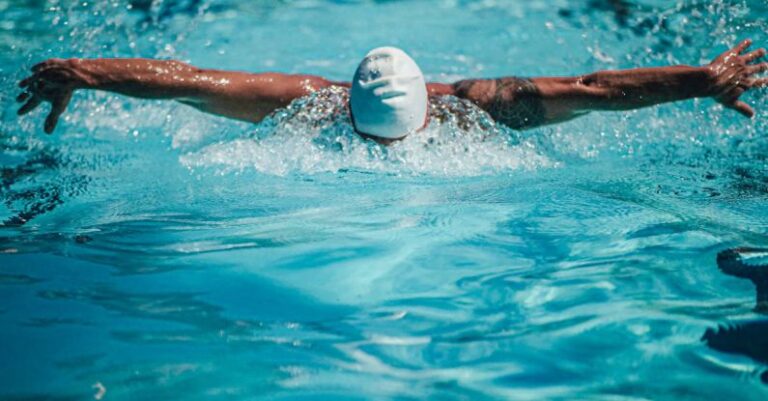 Swim Strokes - A Swimmer Doing the Butterfly Stroke