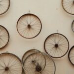 Bike Components - Different shapes and sizes spoke wheels hanging on light wall