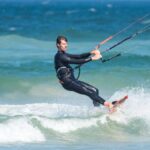 Wetsuit - Man Parasailing While Wearing Wetsuit