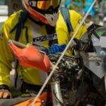 Compression Gear - rider holding his orange motocross