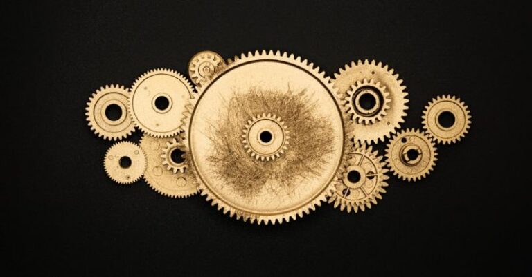 Gear Reviews - Photo of Golden Cogwheel on Black Background