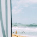 Swimming Tactics - a view of the beach from under the cabana