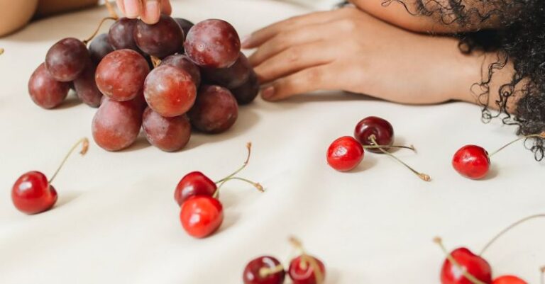 Race Nutrition - Portrait of a Woman with Red Fruits