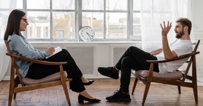 Stride Analysis - Person in Black Pants and Black Shoes Sitting on Brown Wooden Chair