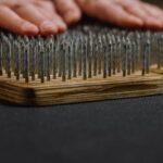 Mental Preparation - Crop man placing arms on sharp nails