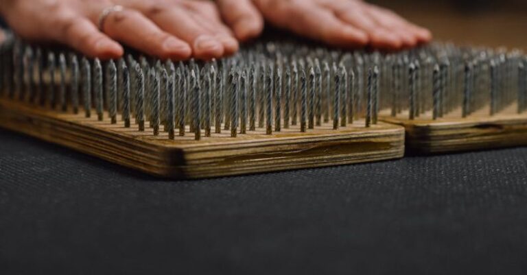 Mental Preparation - Crop man placing arms on sharp nails