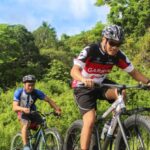 Race Day Nerves - Three Men Riding on Bicycles