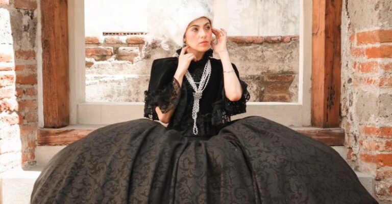 Periodization - Woman Posing in a Period Costume in Front of a Building