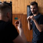 Training Consistency - Two men in a gym doing some boxing