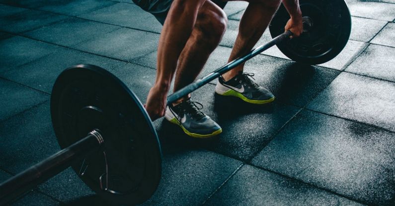 Strength Training - Person Holding Barbell