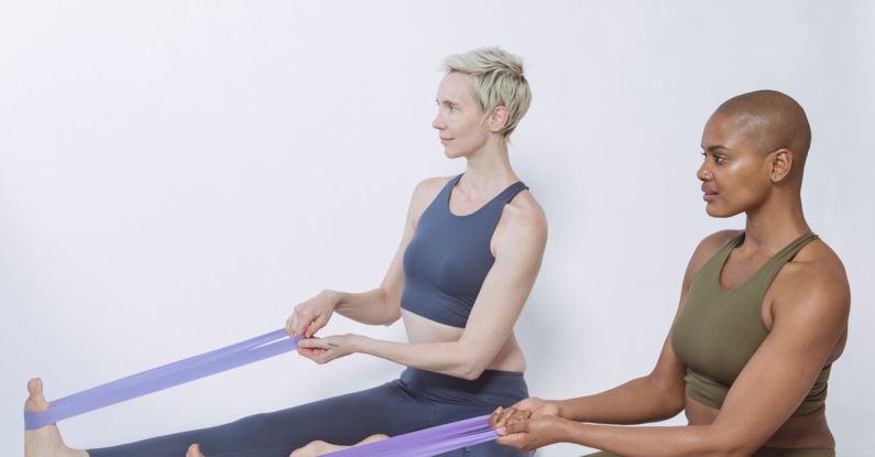 Resistance Training - Multiracial sportswomen exercising with elastic bands