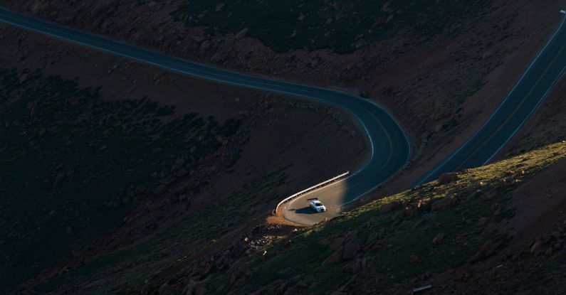 Race Day Anxiety - Aerial View of Road in the Middle of Green Trees